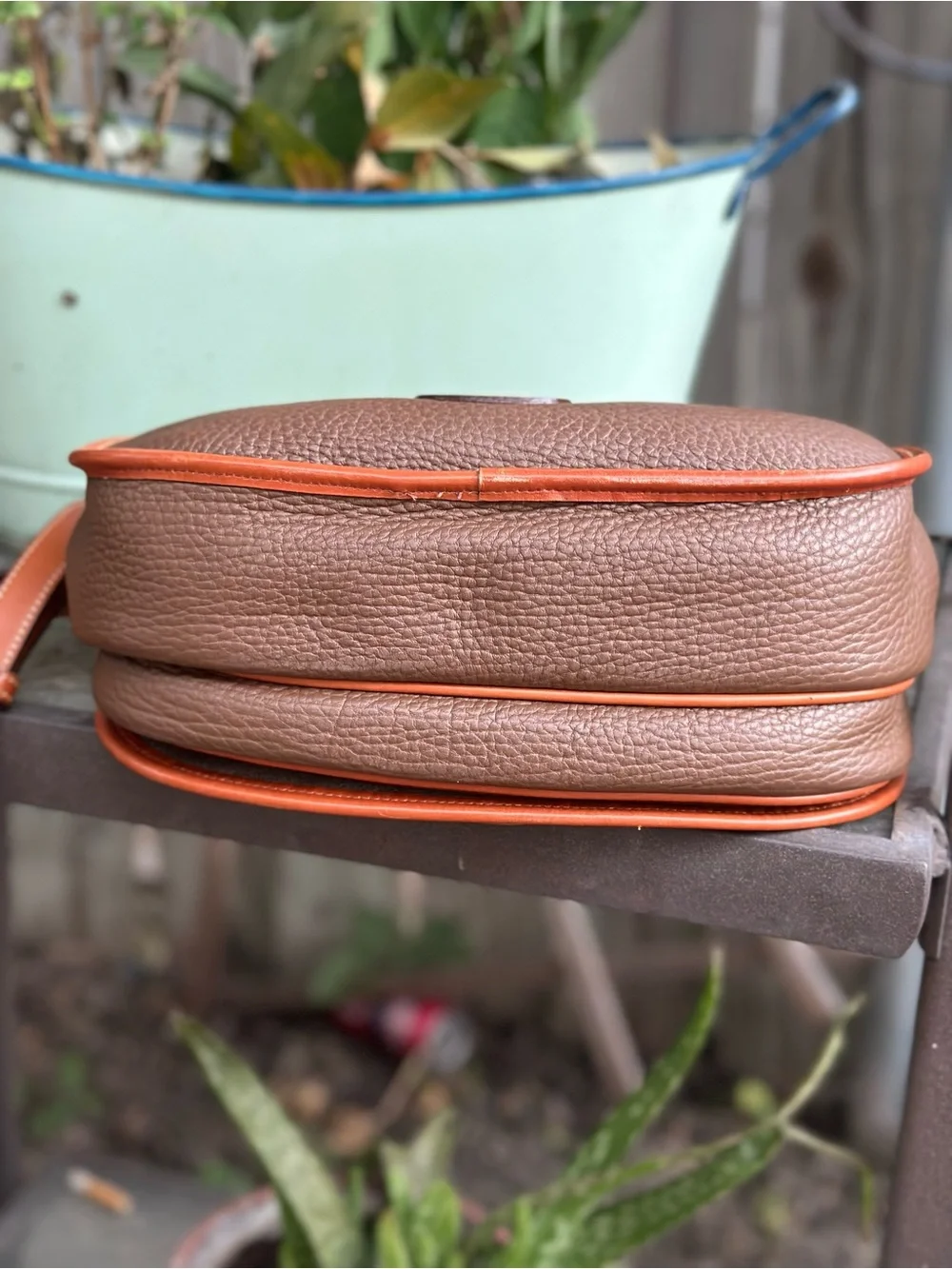 Dooney & Bourke Brown Pebbled Leather Horseshoe Crossbody with Tan Trim